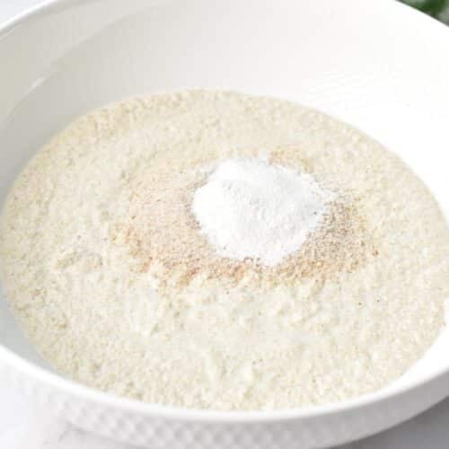 a bowl with quinoa blended in water, husk powder and baking powder
