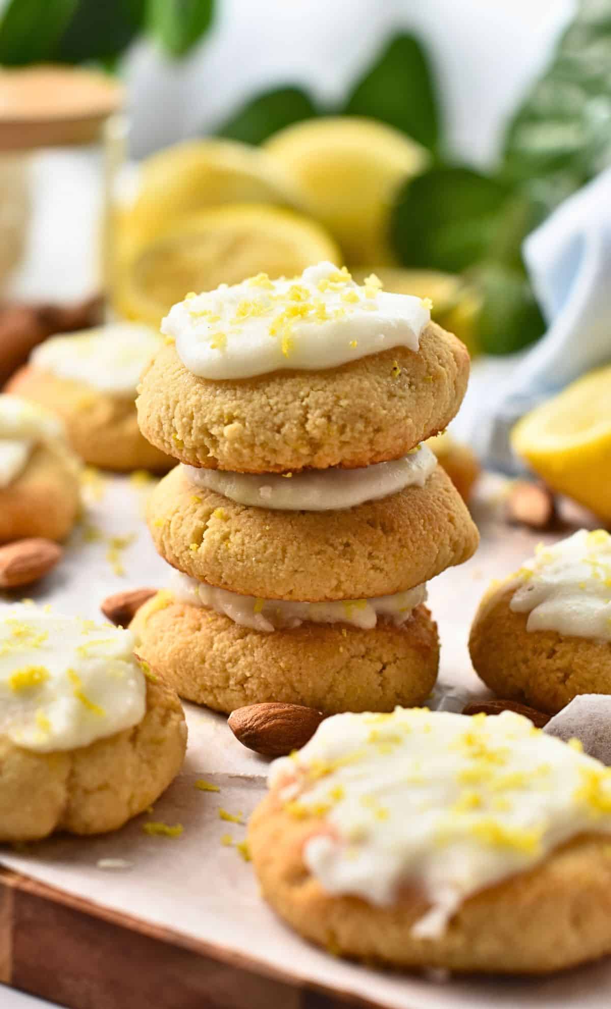 Almond Flour Lemon Cookies decorated with lemon frosting stacked.