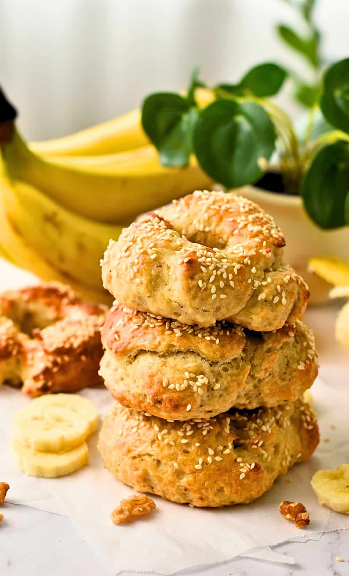 Banana Bagels stacked on a table.