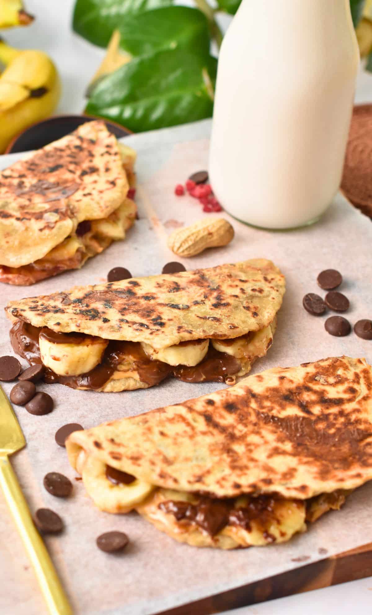 Banana Tortillas filled with banana and chocolate chips and toasted.