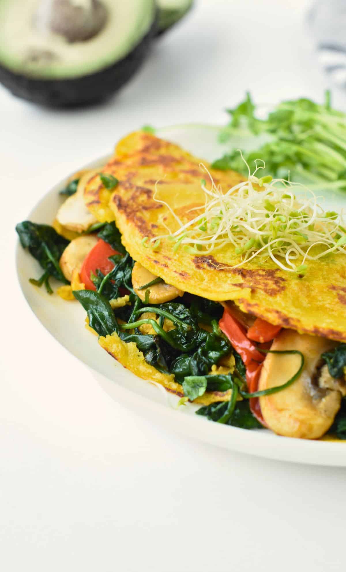 Vegan chickpea omelette with vegetable fillings