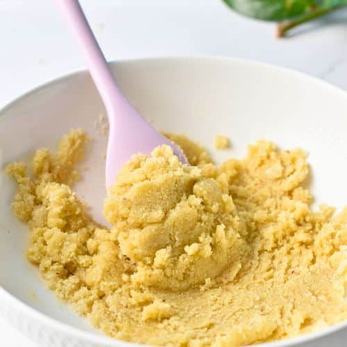 Combined Almond Croissant Pastry dough ingredients in a bowl with a spatula.