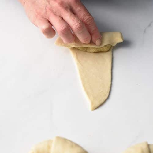 Rolling Almond Croissant Pastry.