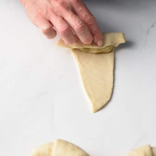 Rolling Almond Croissant Pastry.