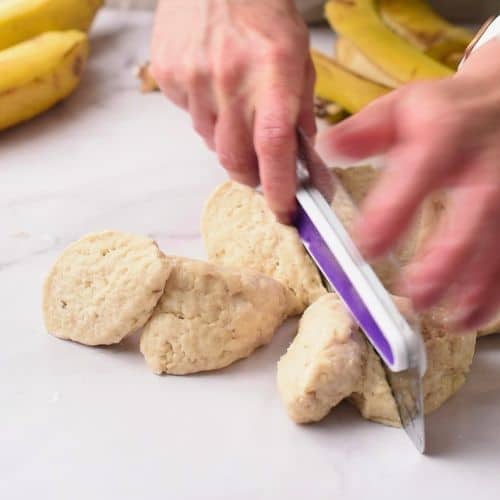 Dividing the banana tortilla dough into small portions.