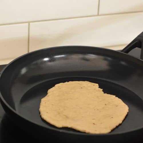 Banana tortillas on a frying pan.