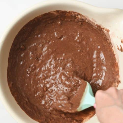 Chocolate Protein Muffin batter stirred in a mixing bowl.