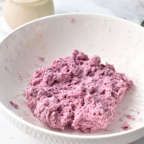 Sweet potato donut dough in a mixing bowl.