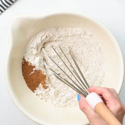 Dry vegan buckwheat crepe batter ingredients in a mixing bowl.