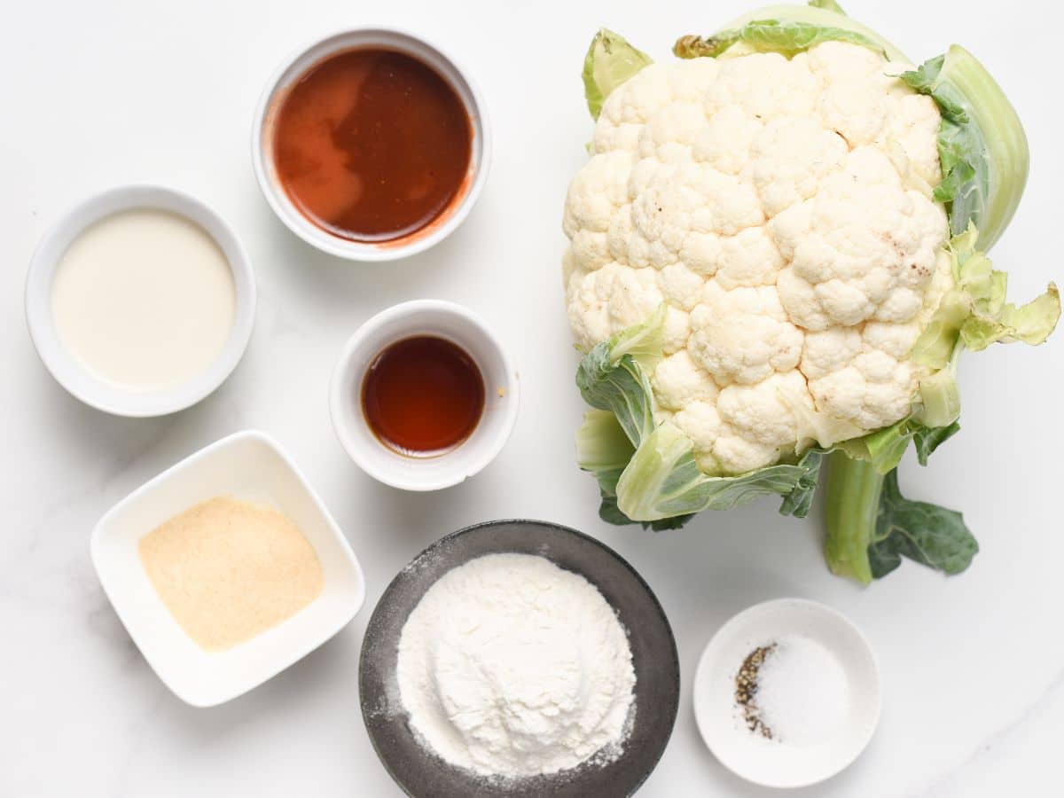 Ingredients for Air Fryer Buffalo Cauliflower in bowls and ramekins.