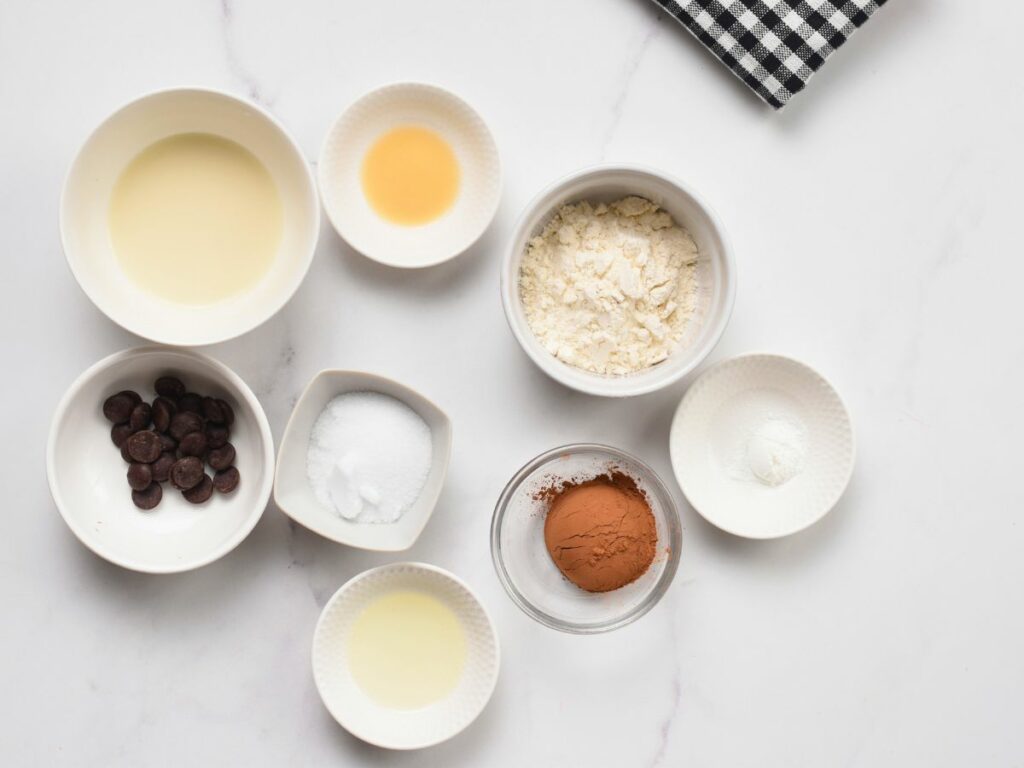 Ingredients for Healthy Mug Cake in bowls and ramekins.