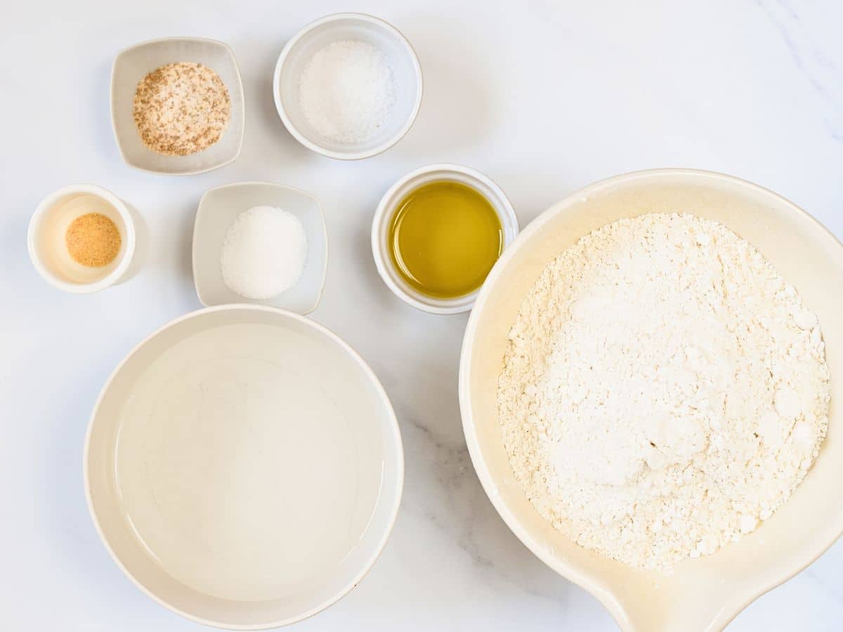 Ingredients for Spelt Pizza Dough in bowls and ramekins.