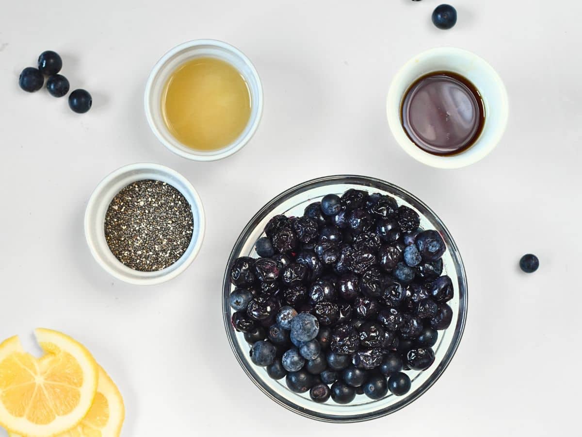 Ingredients for Vegan Blueberry Cobbler in bowls and ramekins