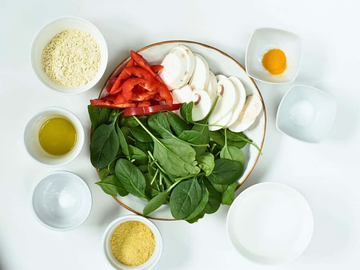 Ingredients for Vegan Chickpea Omelette in bowls and ramekins.