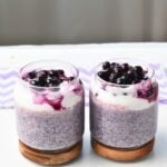 Blueberry Protein Overnight Oats in three jars.