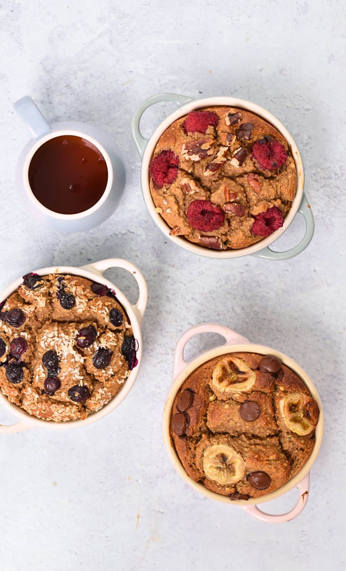 High Protein Baked Oats in 3 cast-iron casseroles.