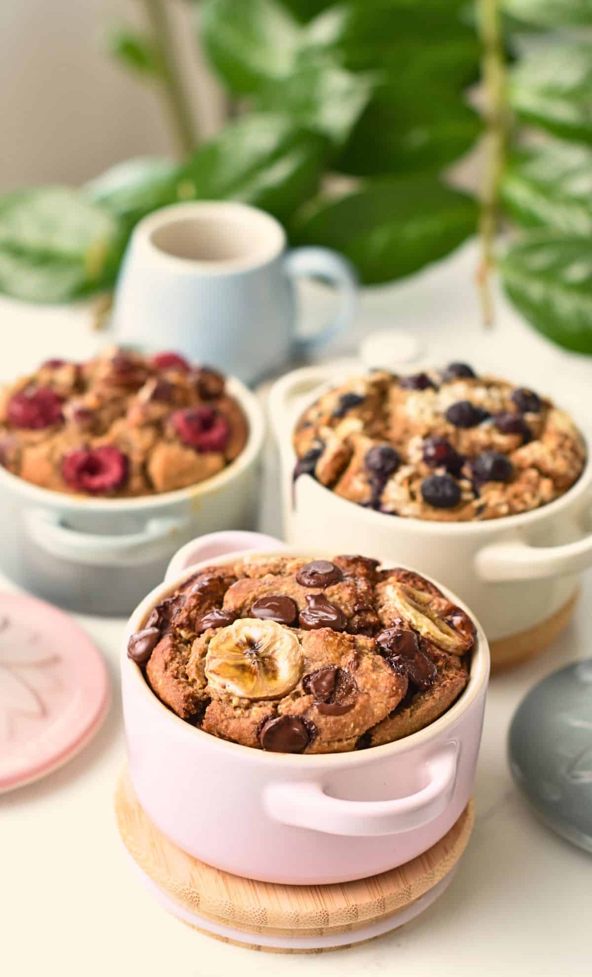 High Protein Baked Oats in 3 cast-iron casseroles.