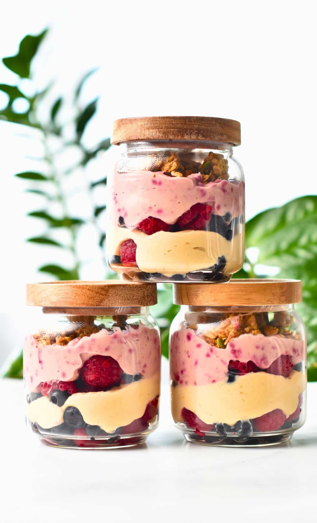 Three jars of High Protein Yogurt Parfait stacked on a table