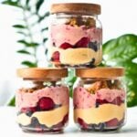 High Protein Yogurt Parfait in three jars stacked