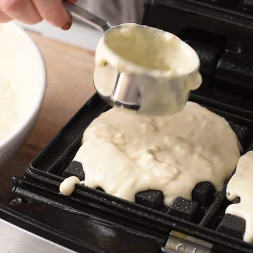 Banana Churros Waffle batter poured on a hot waffle maker.