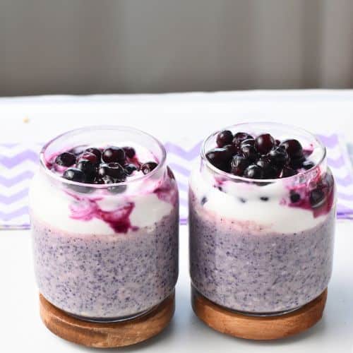 Blueberry Protein Overnight Oats in two jars.