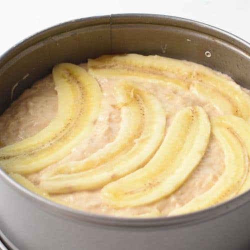 Transfer to a baking pan and add sliced bananas on the top.