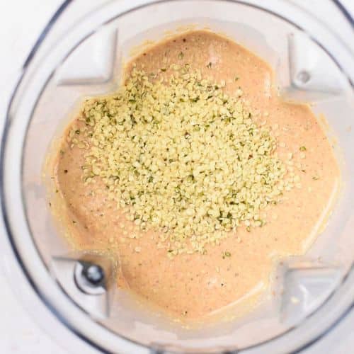Adding hemp seeds to the High Protein Baked Oats.