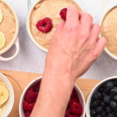Adding fresh fruits to the High Protein Baked Oats.