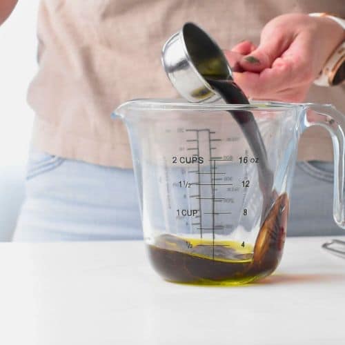 Making the balsamic vinegar in a measuring cup.