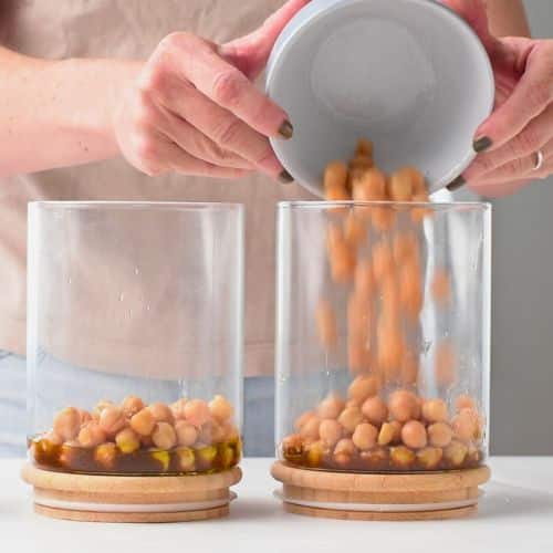 Adding the chickpeas to the salad.