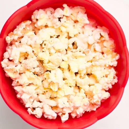 Popped popcorn in a popping corn cup.