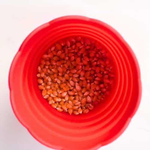 Popping corn in a popping cup.