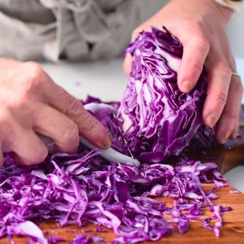 Shredding red cabbage.