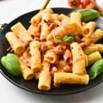 Vegan Baked Feta Pasta on a black plate.