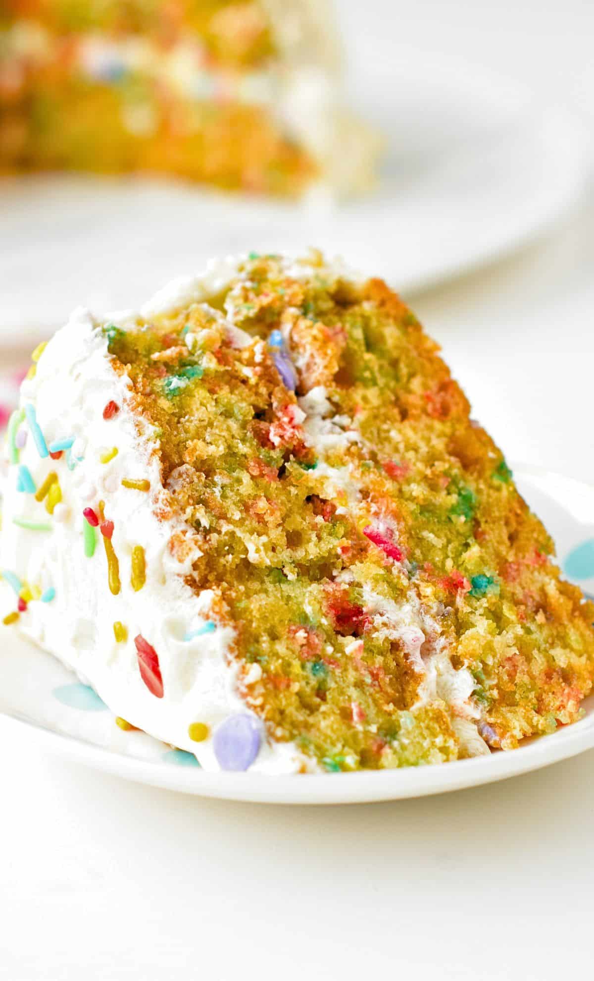 Slice of vegan sprinkle cake.