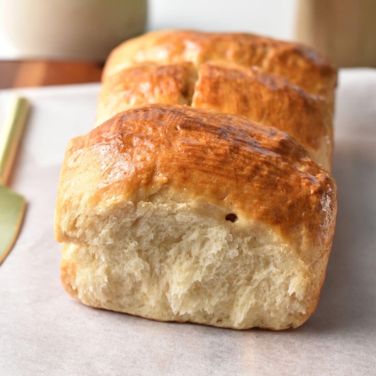 Yogurt Buns on a wooden board with parchment paper.