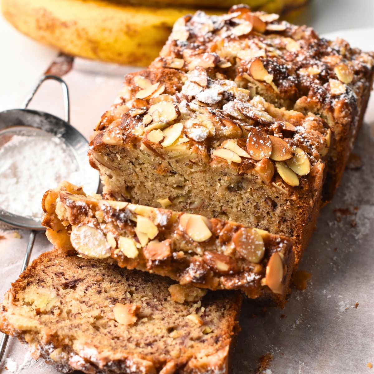 Almond Banana Bread sliced on a table