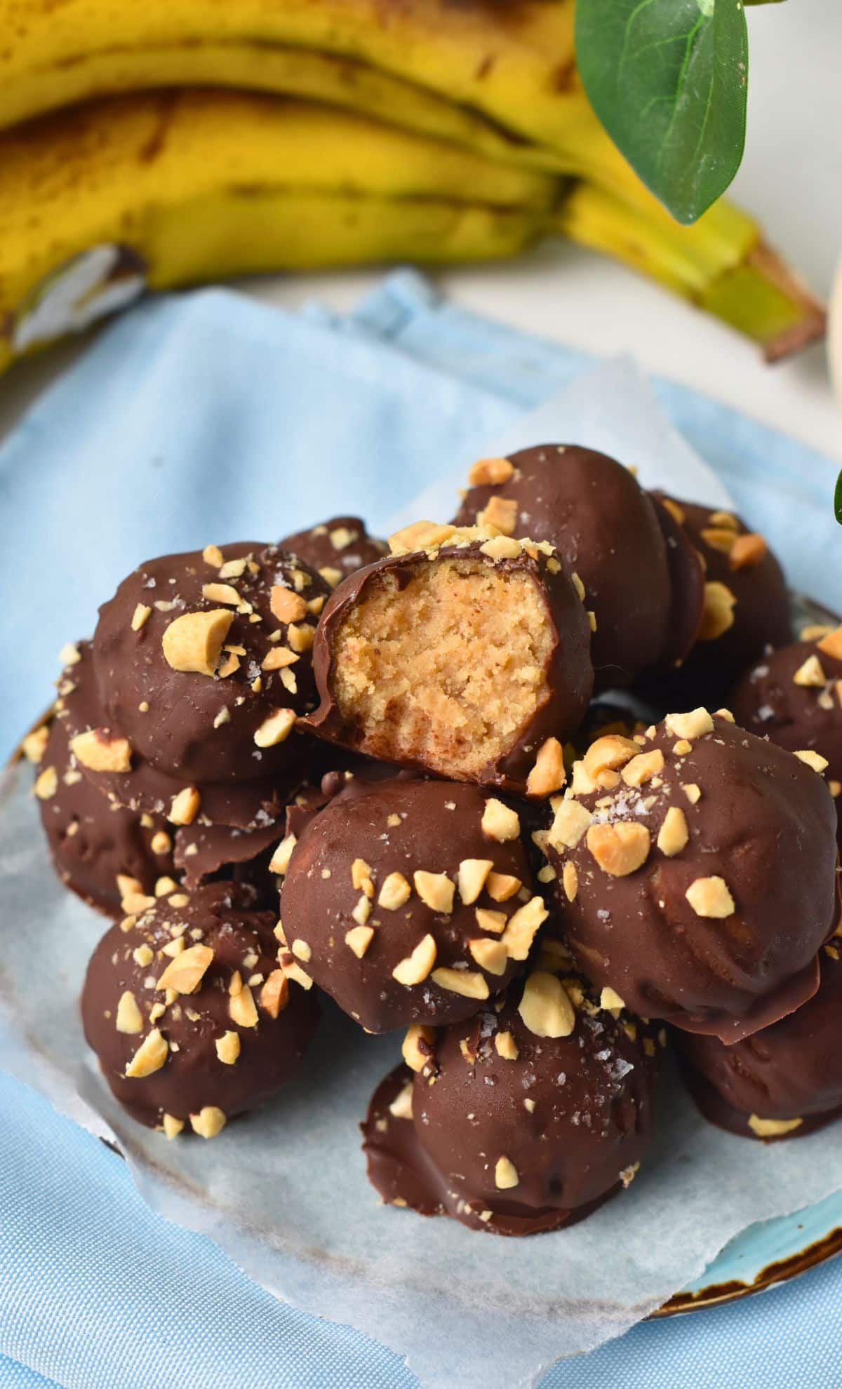 Banana Peanut Butter Balls on a plate with one cut in half.