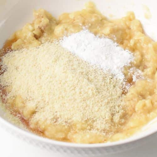 Almond Banana Bread batter ingredients in a bowl.