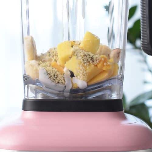 Banana Mango Smoothie ingredients in a blender.