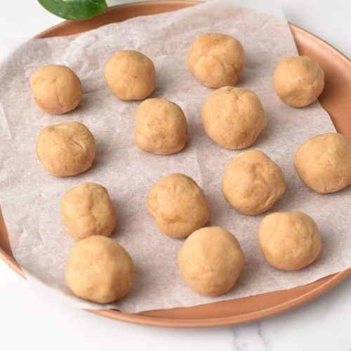 Banana Peanut Butter Balls rolled on a plate.
