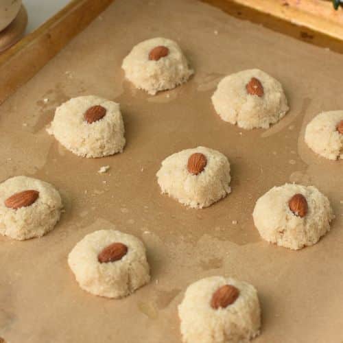 Adding an almond on the Coconut Almond Cookies