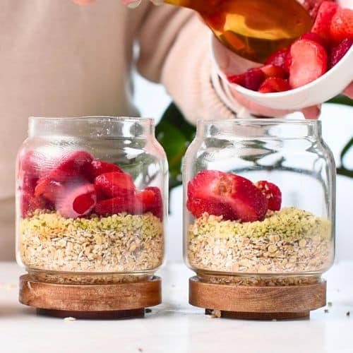 Adding strawberries to the Strawberry Protein Overnight Oats