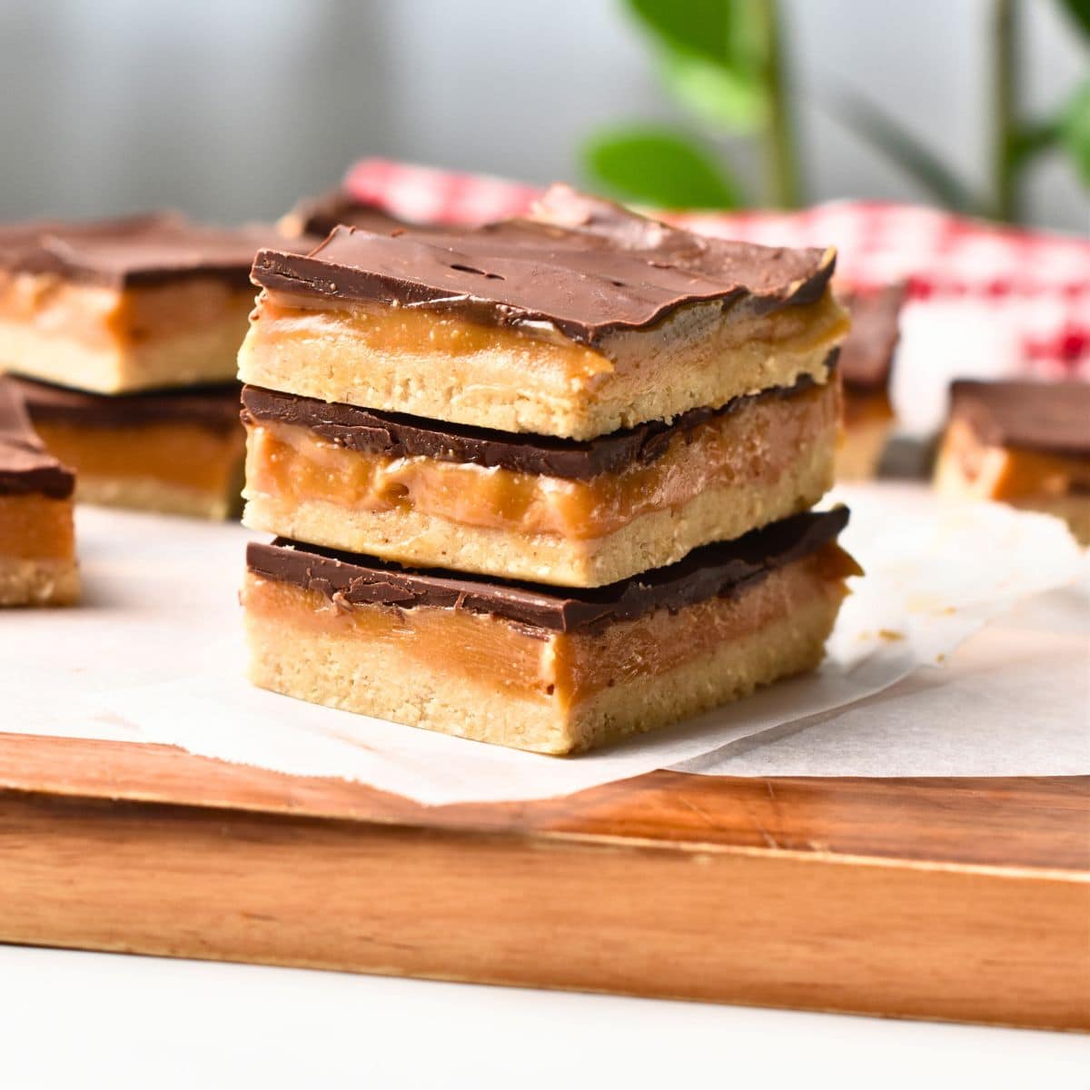 No Bake Twix Bars on a chopping board.