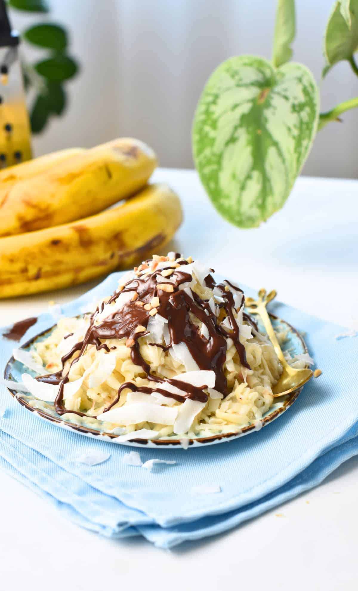 Shaved Banana Ice Cream with magic chocolate and crushed peanuts