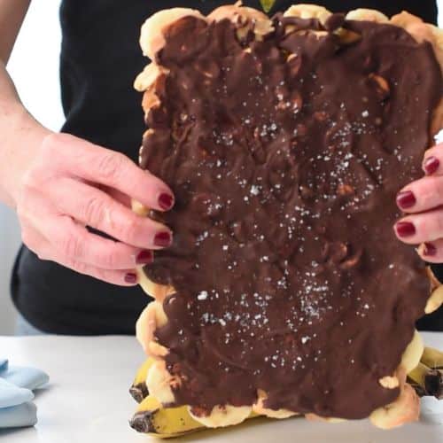 Holding the Frozen Banana Bark uncut,