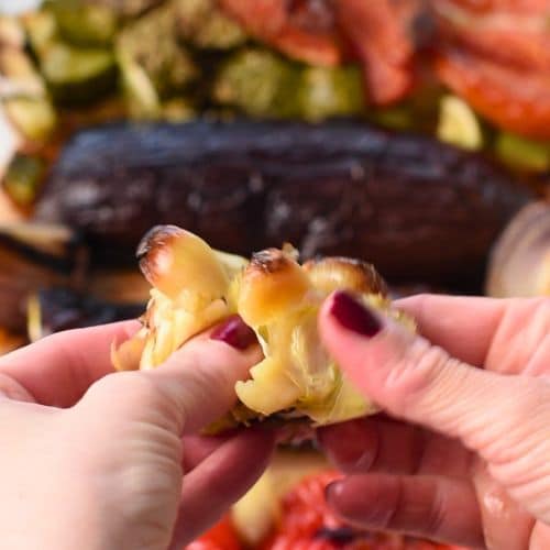 Squeezing roasted garlic.