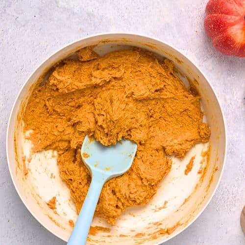 Pumpkin Donut Holes batter in a mixing bowl.