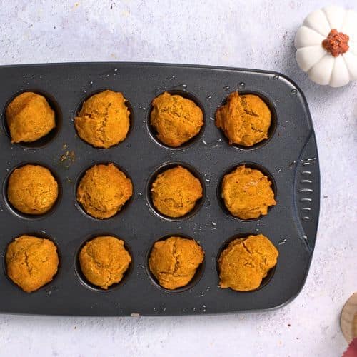 Pumpkin Donut Holes batter in a muffin pan.