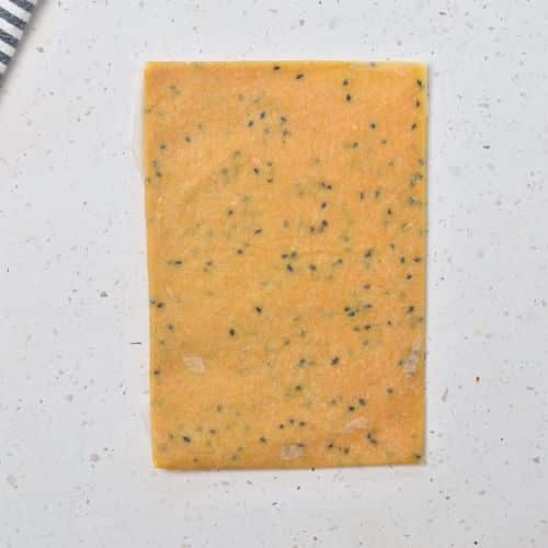 Rolled Chickpea Cracker dough in a rectangle shape.